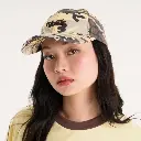 SURVIVORCAP_1_e9a20624-2c72-4de9-8294-d9568189322e.webp